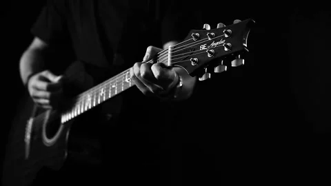 A young boy plays a guitar 動画素材 145508699