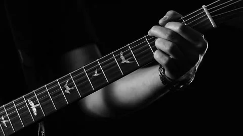 A young boy plays a guitar Video stock 145509141