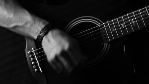 A young boy plays a guitar Stock Footage 145509282