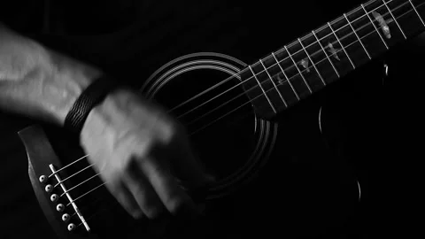 A young boy plays a guitar Stock Footage 145509326