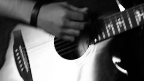 A young boy plays a guitar Stock Footage 145509339