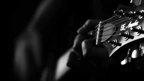 A young boy plays a guitar Stock Footage 145509420