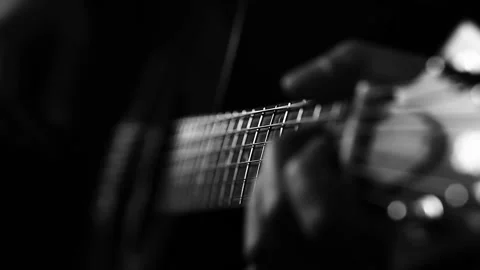A young boy plays a guitar Stock Footage 145509478