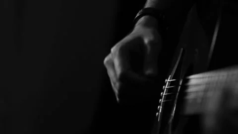 A young boy plays a guitar Stock Footage 145509521