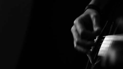 A young boy plays a guitar Stock Footage 145509538