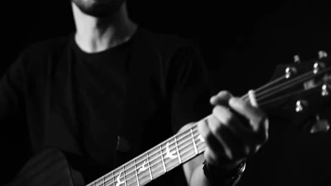 A young boy plays a guitar Stock Footage 145509558