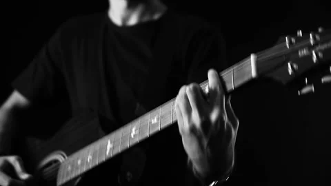 A young boy plays a guitar Stock Footage 145509577