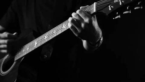 A young boy plays a guitar Stock Footage 145509580
