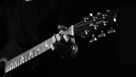 A young boy plays a guitar Stock Footage 145509635