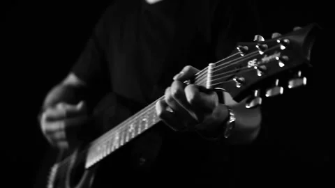 A young boy plays a guitar Stock Footage 145509655