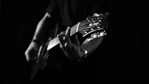 A young boy plays a guitar Stock Footage 145509707