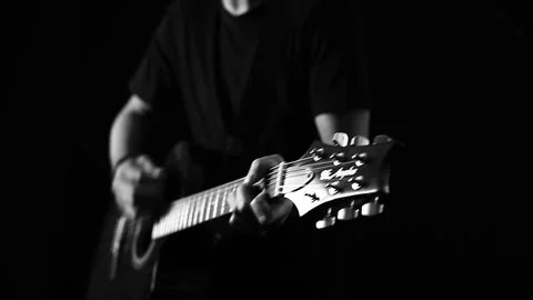 A young boy plays a guitar Stock Footage 145509710