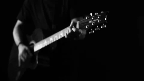 A young boy plays a guitar Stock Footage 145509723