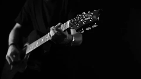 A young boy plays a guitar Stock Footage 145509743