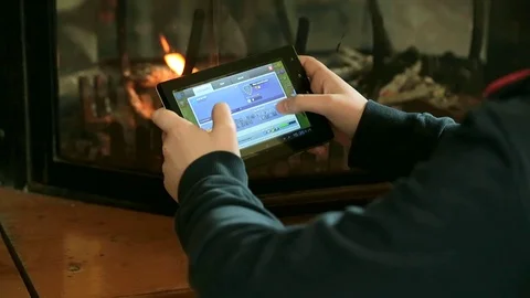 A young boy plays with his tablet. Video stock 88459631