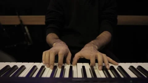 A young boy plays a keyboard 動画素材 145508440