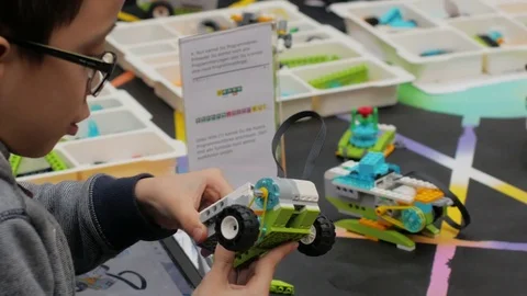 Young boy plays at public Maker space Stock-Footage 83204051