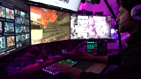 A young boy plays a video game in a neon-lit, vibrant gaming room. Video stock 305336127