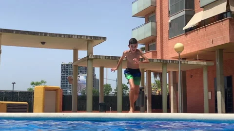 Young boy into the pool Stock Footage 202645391