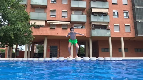 Young boy into the pool Stock Footage 202645909
