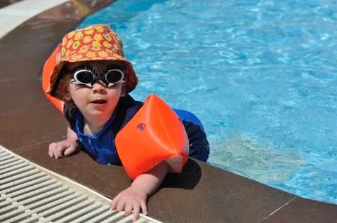 Young boy at poolside Stock Photos