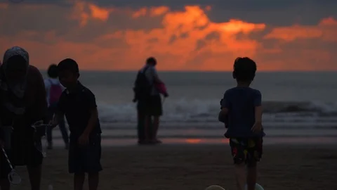 Young Boy Popping Bubbles Sunset Beach Stock Footage