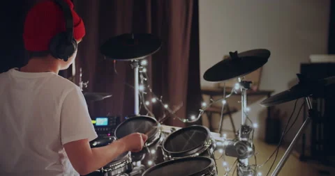 Young boy practice playing electronic instrument drums at musical studio 動画素材 140474708