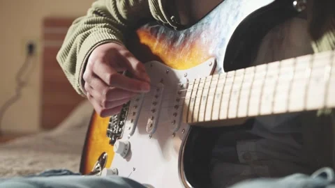 Young Boy Practices Electric Guitar at Home, Developing Musical Skills Stock Footage 327815265