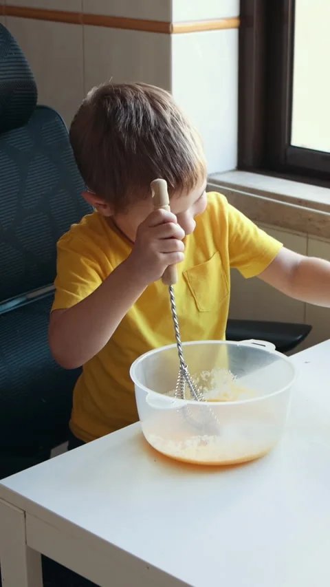 Young boy preparing apple juice in kitchen Stock Footage 327134346