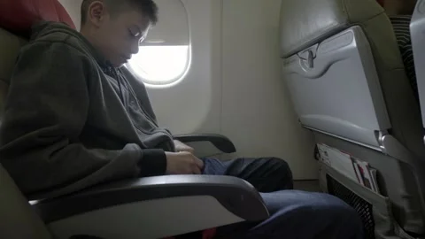 Young Boy Preparing for Takeoff on Airplane Stock Footage 314667010