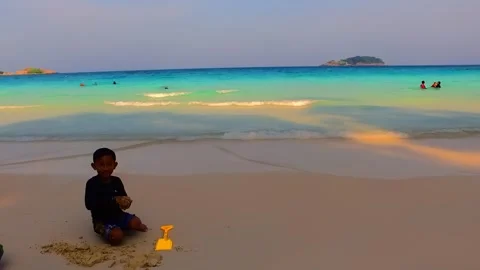 A young boy pretends to chase a drone camera. Stock Footage 334593569