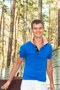 A young boy pulls cart before Stock Photos