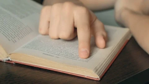 Young boy reading book . Child reading book. Kid doing homework Stock Footage 69865223