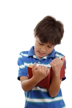 Young boy reading a book Stock Photos