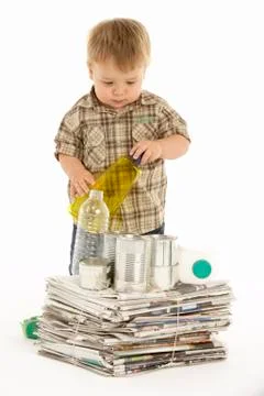 Young Boy Recycling In Studio Stock Photos
