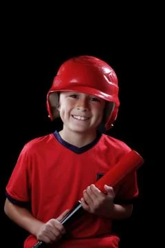 Young boy with red baseball bat Stock Photos