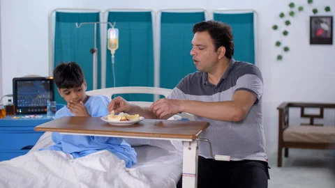 A young boy is refusing to eat food in the hospital - bland food, child care,... Stock Footage 248814510