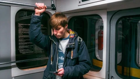 Young boy rides the subway and used smartphone Stock Footage 86311091