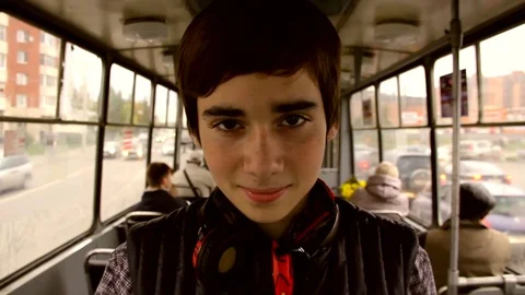 Young Boy Riding Bus And Looking in the camera Video stock 70428962