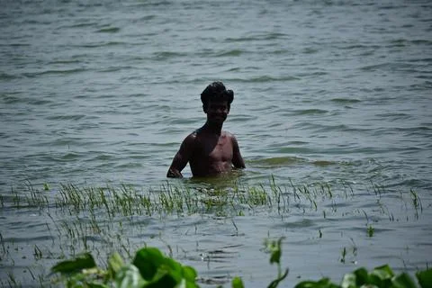 Young boy into the river Stock Photos