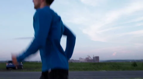 Young boy running along the road 動画素材 64618162