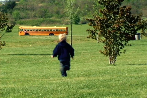 Young Boy Running to a Bus Stock Footage 371685