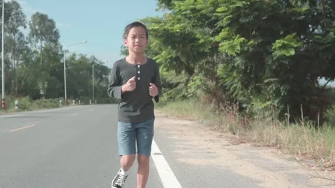 Young boy running during summer day Stock Footage 113176459