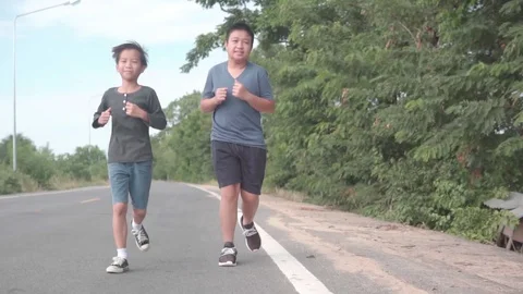 Young boy running during summer day Stock Footage 115103323