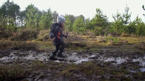Young Boy running in the forest Stock Footage 84315270