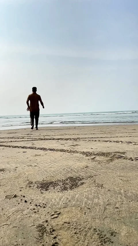 Young Boy Running Toward the Sea Joyful Moment of Freedom Stock-Footage 311697293