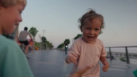 A young boy runs while laughing out loud. The happy toddler is having a Stock Footage 207844067