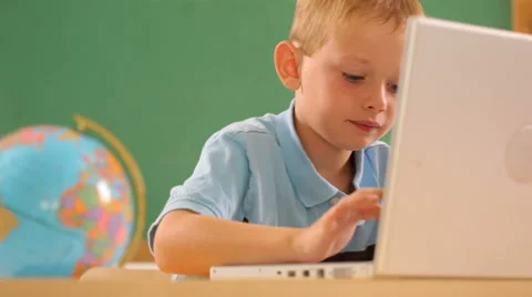 Young boy at school typing on laptop computer Stock-Footage 61670012