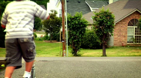 Young Boy on a Scooter Stock Footage 371677