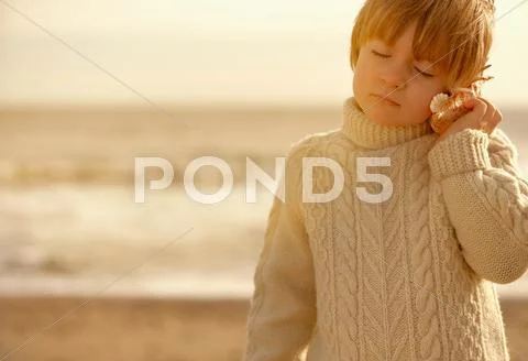 Young Boy By Sea, Listening In Seashell